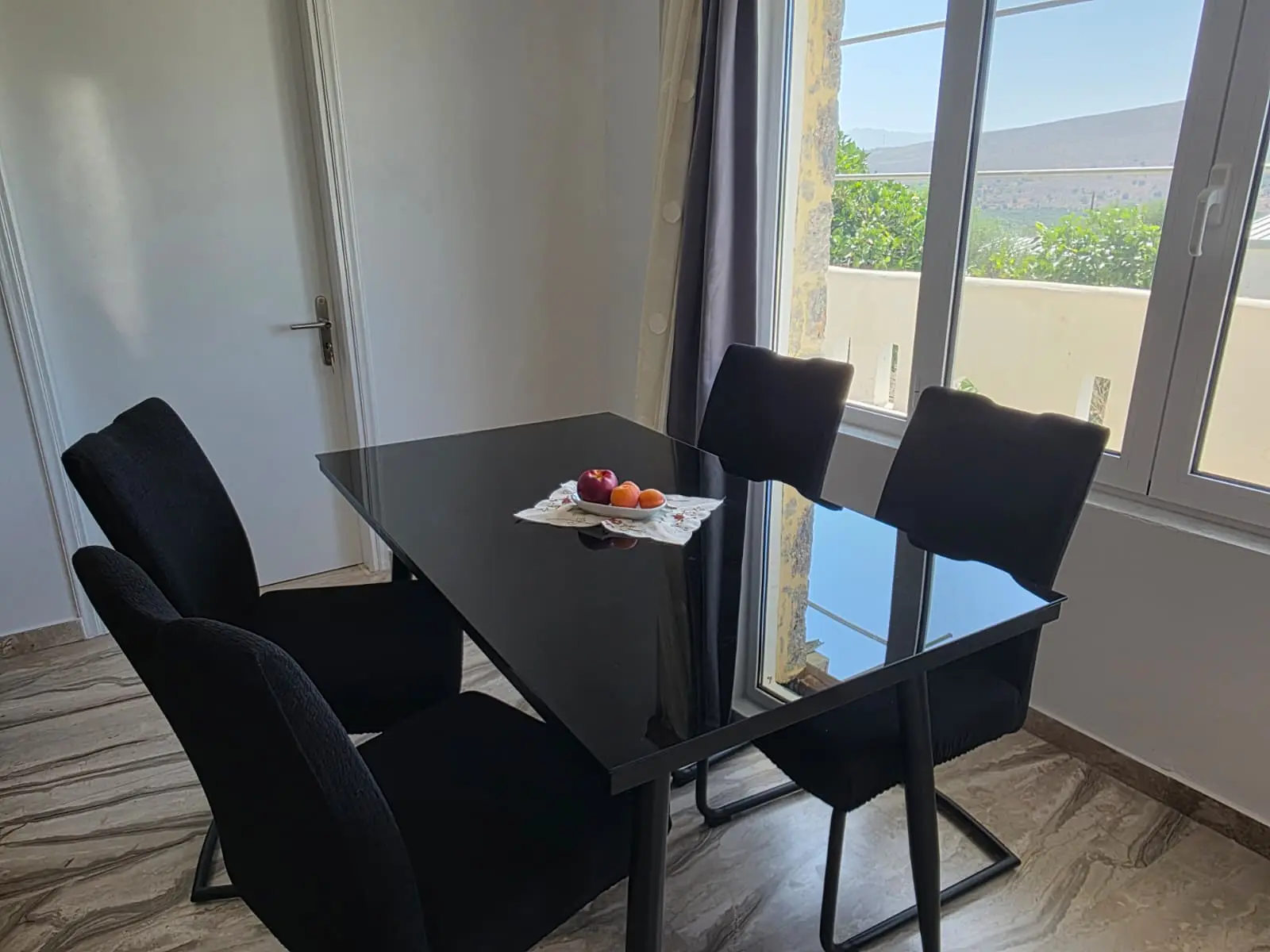 Olive Apartment dining table and kitchen