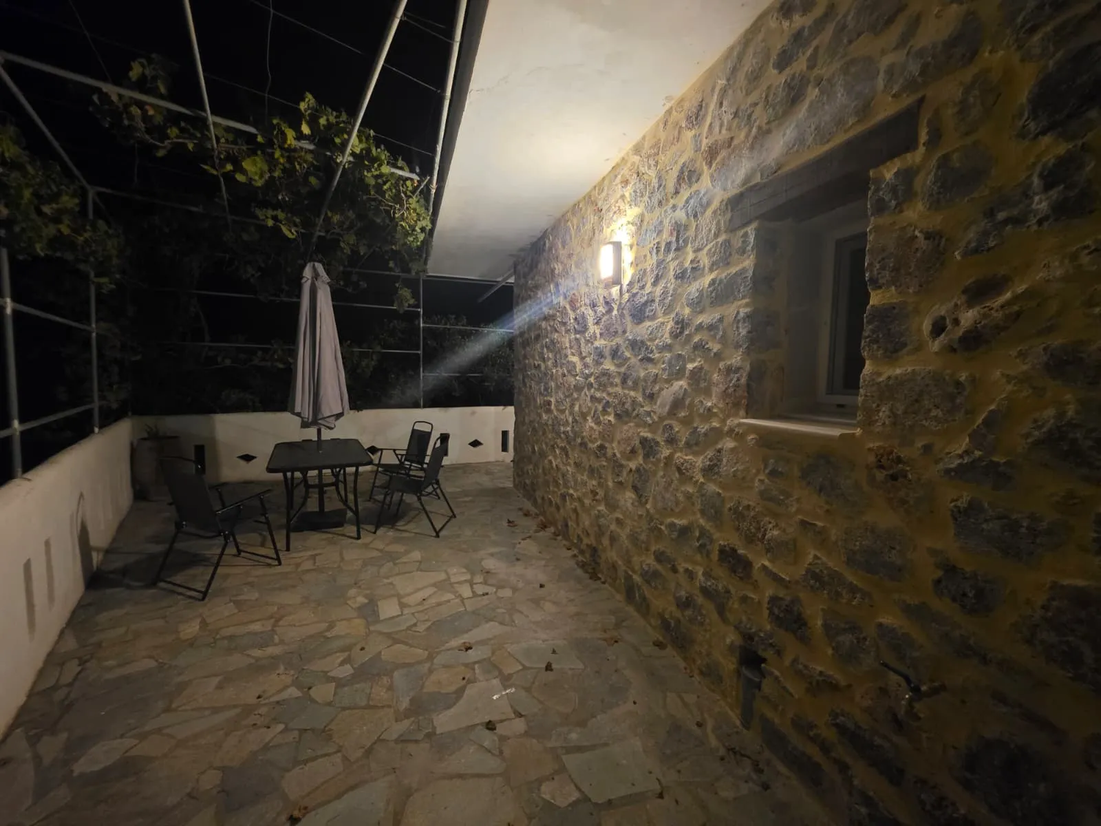 Olive Apartment outdoor space at night