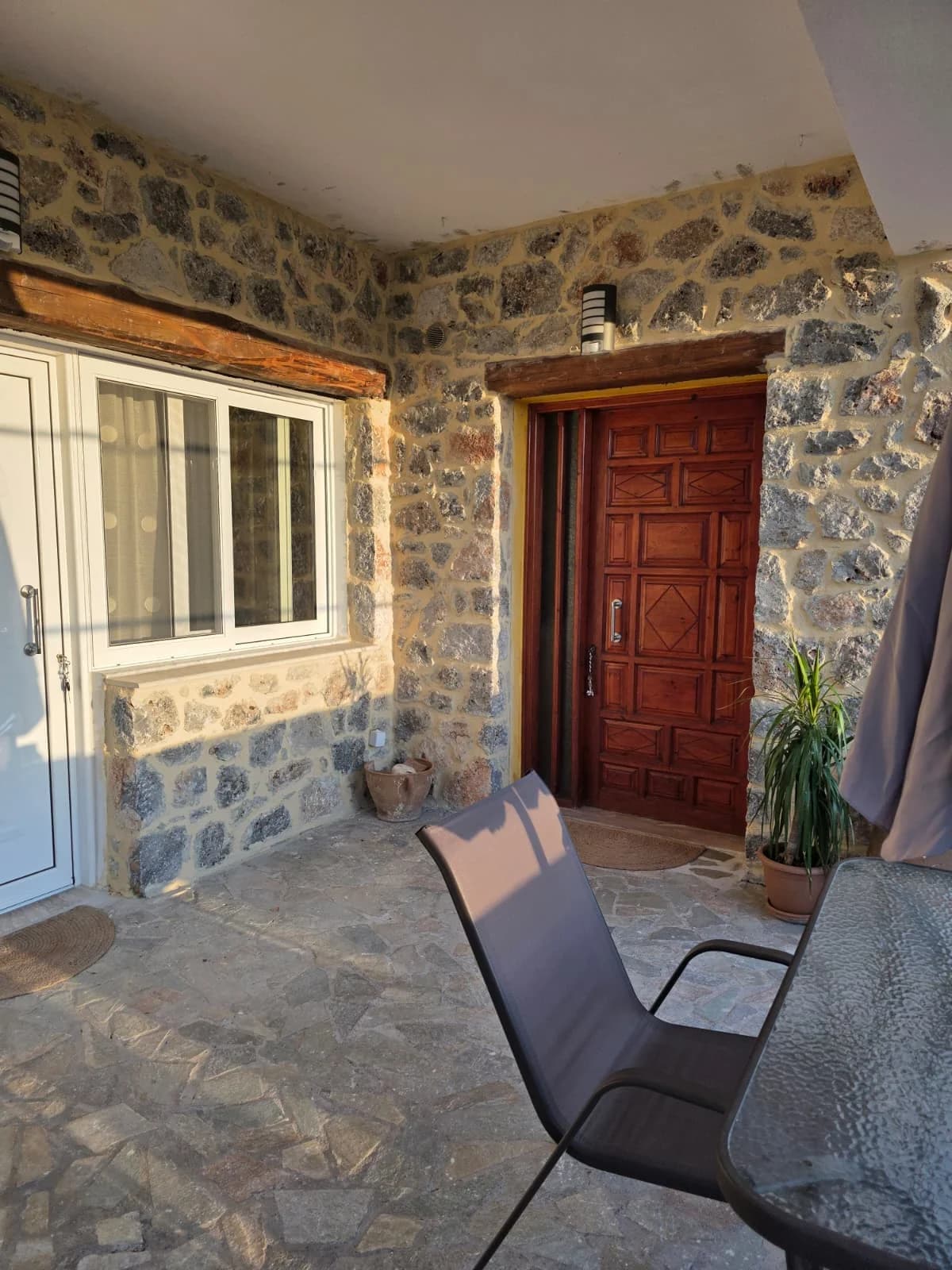 Stone apartment patio with outdoor seating